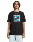 Person wearing a black Volcom t-shirt with a logo on a white background