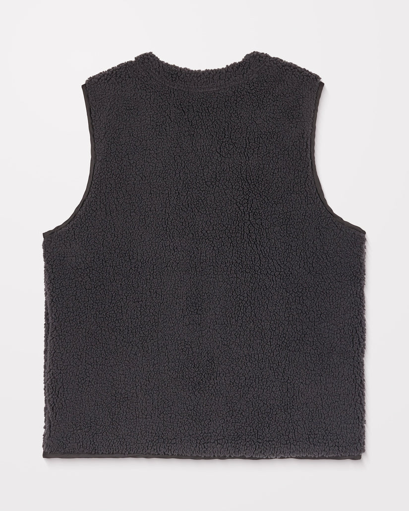 Black fleece vest on a light gray background