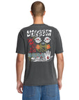 Person wearing a dark gray t-shirt with colorful designs on the back, on a white background