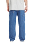 Person wearing blue jeans on a white background