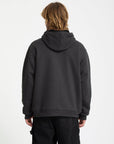 Person wearing a dark gray hoodie on a white background