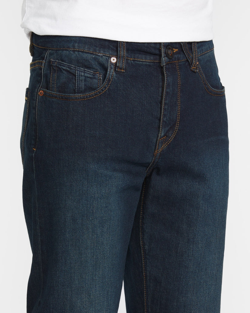 Dark blue jeans on a white background