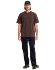 Man wearing a brown t-shirt and black cap on a white background