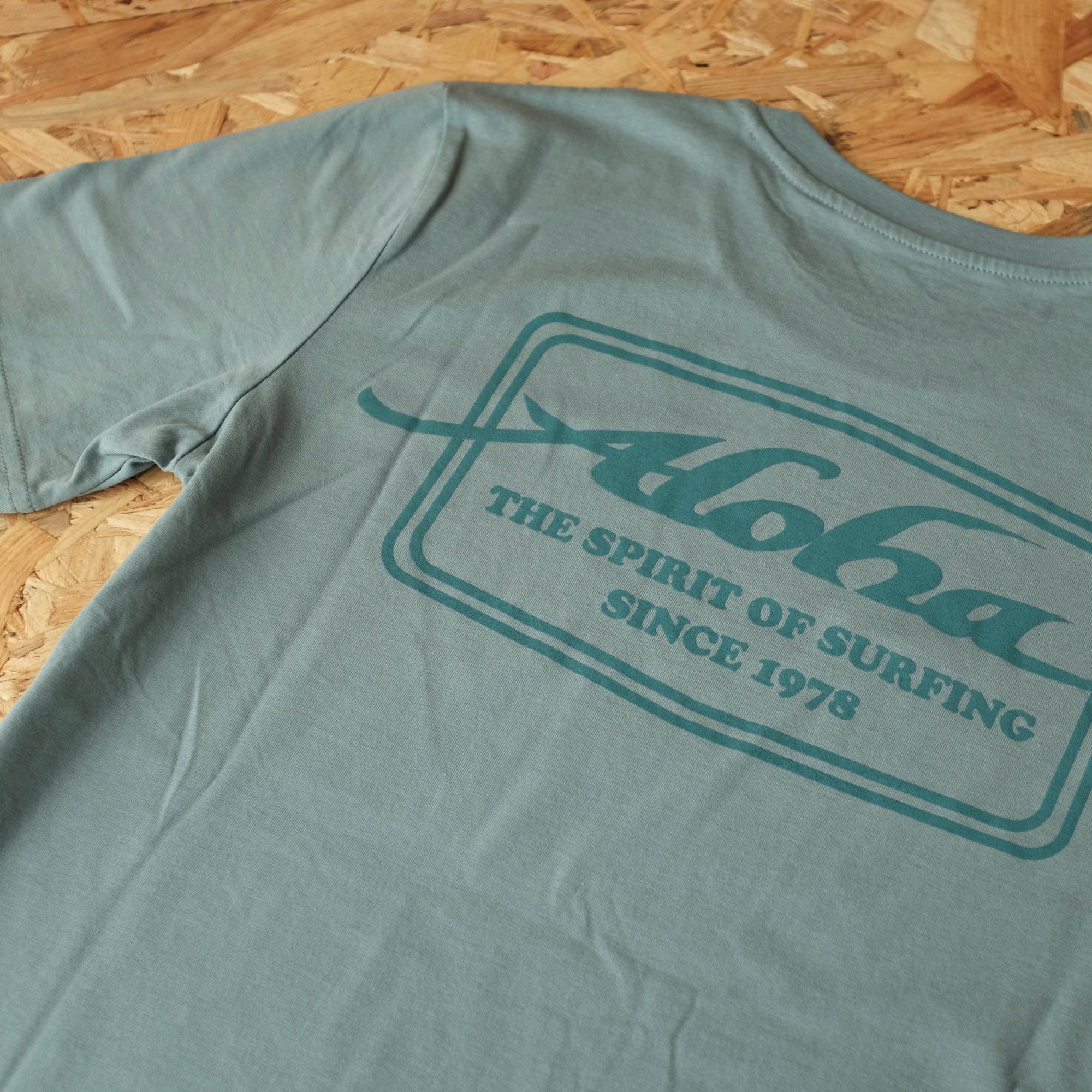 Aloha Shapers Badge T-Shirt – Unisex Short Sleeve Tee - Slate Blue - ManGo Surfing