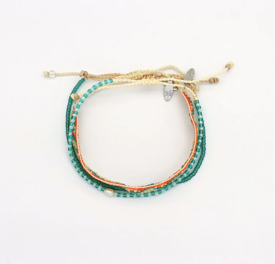 A multi-strand beaded bracelet featuring teal, orange, and cream threads, adorned with small white beads and a butterfly charm, displayed on a plain white background.