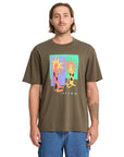Man wearing a brown t-shirt with a colorful graphic design on a white background