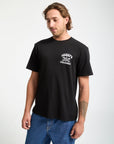 Man wearing a black t-shirt with a logo on a white background